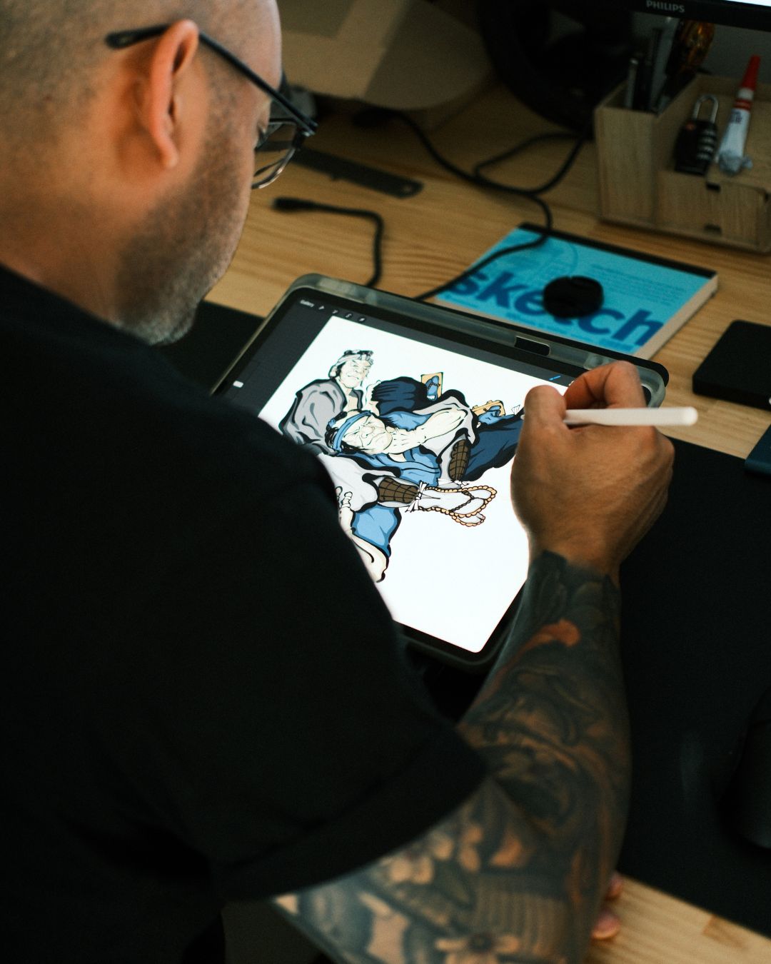 grappler holding 10 pack of finger tape with white finger tape wrapped around his fingers. Grappler is wearing kakuto culture's rashie.