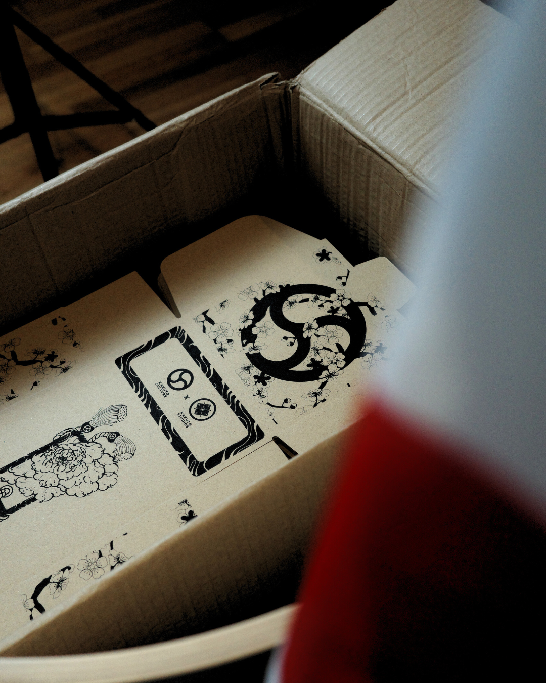 grappler holding 10 pack of finger tape with white finger tape wrapped around his fingers. Grappler is wearing kakuto culture's rashie.