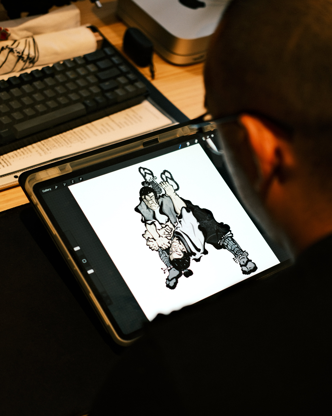 grappler holding 10 pack of finger tape with white finger tape wrapped around his fingers. Grappler is wearing kakuto culture's rashie.
