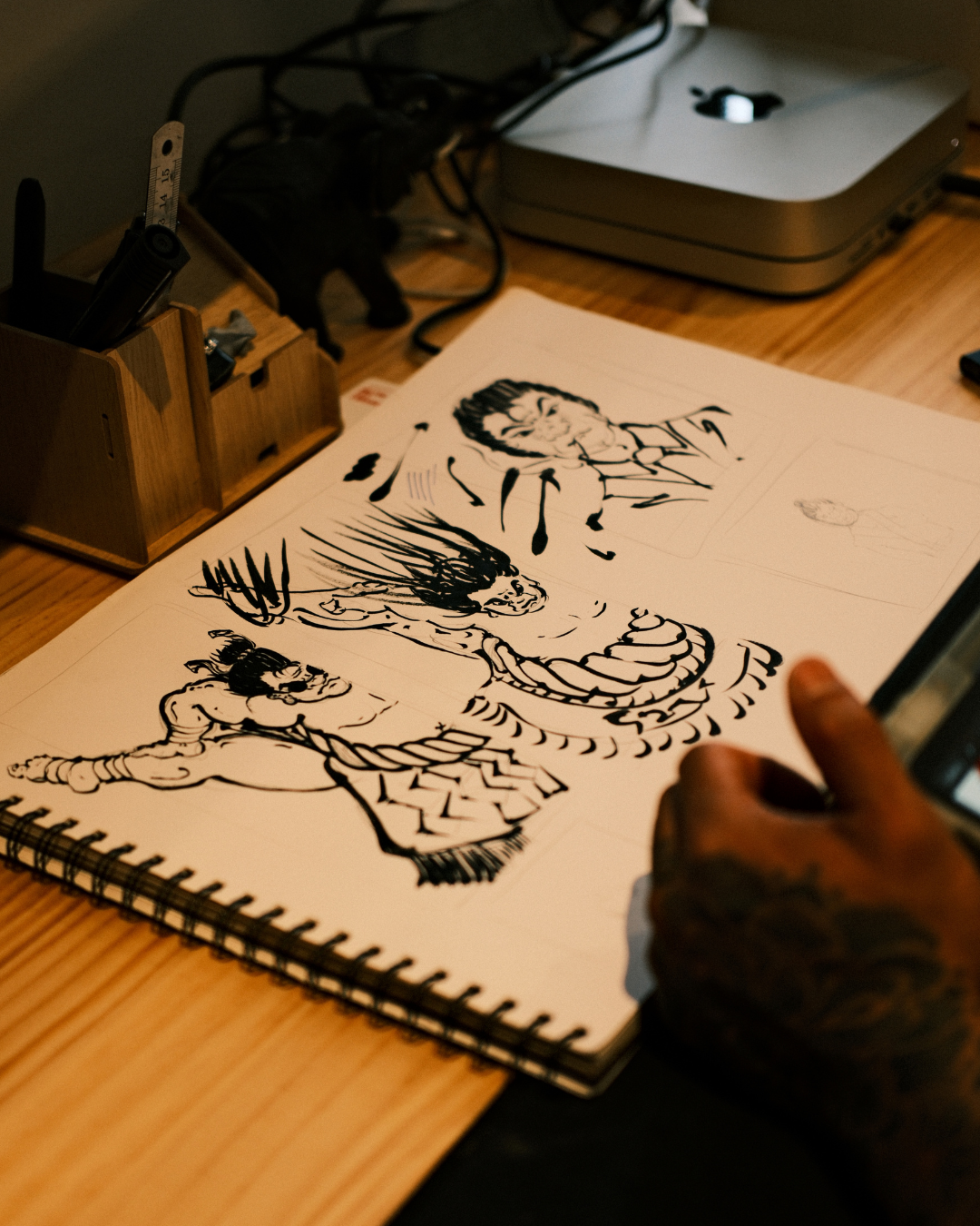 grappler holding 10 pack of finger tape with white finger tape wrapped around his fingers. Grappler is wearing kakuto culture's rashie.